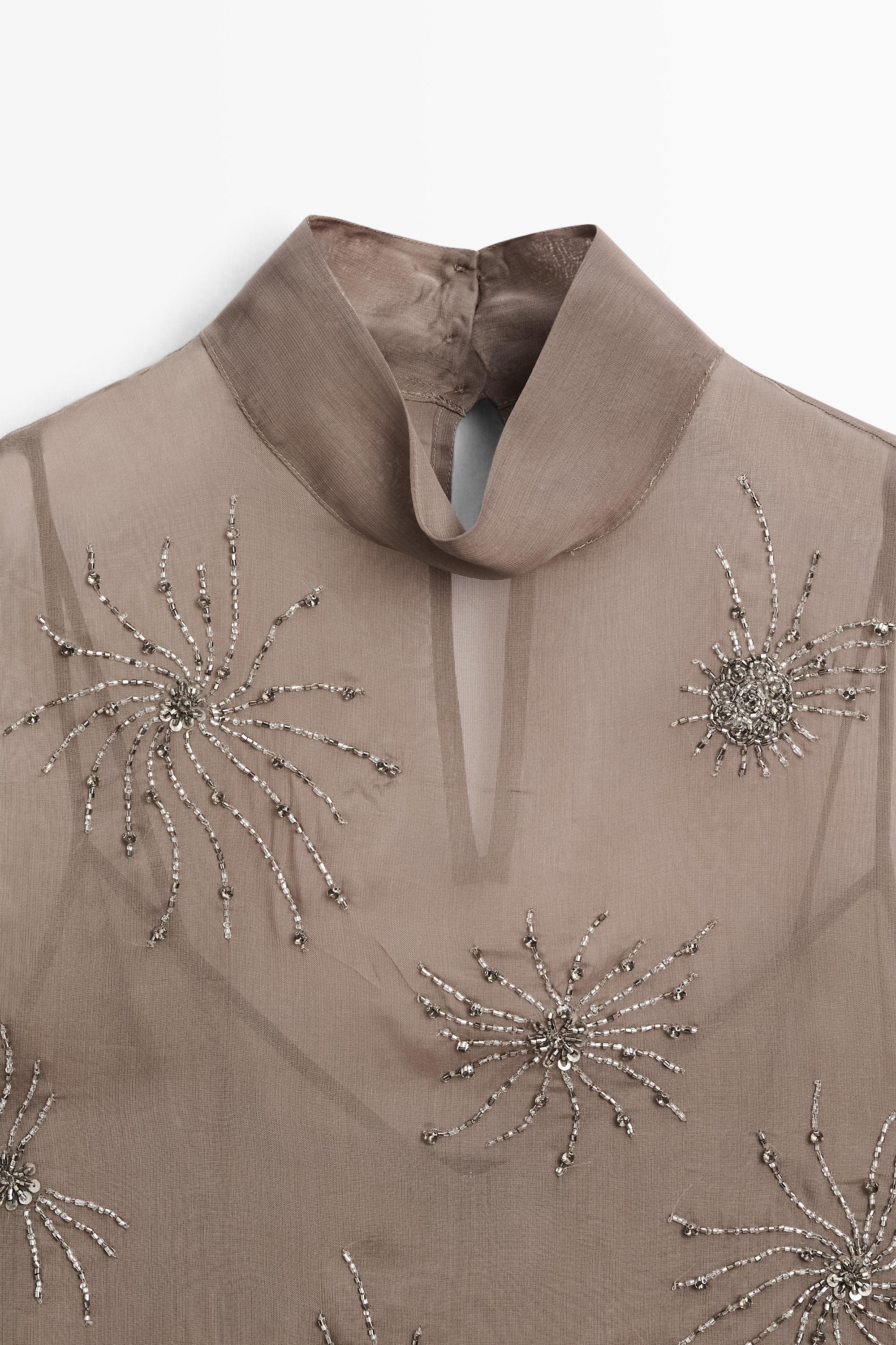 Semi-sheer top with embroidered detail